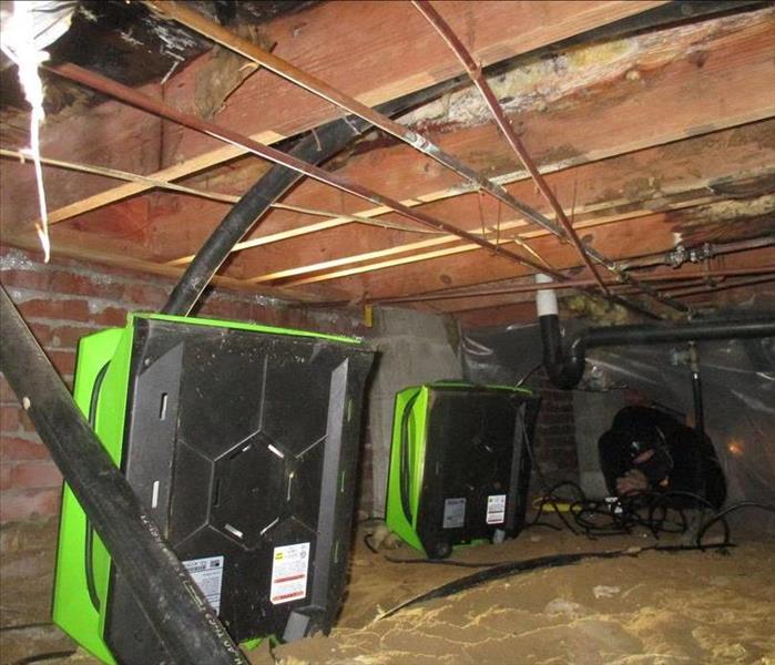 drying equipment set up in crawlspace