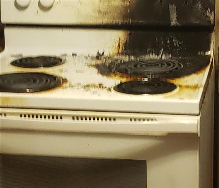 Picture of stove that had a grease fire.